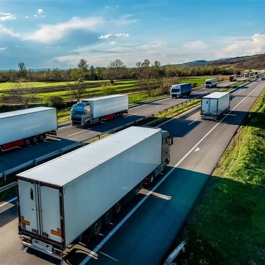 A picture of freight trucks on a road