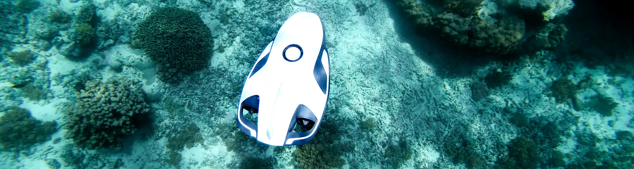 Underwater hands free drone explore the seabed. For use by boaters, scuba divers and in underwater exploration. Future technology.