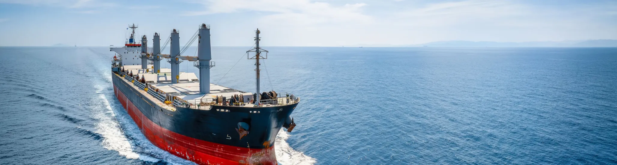 Aerial view of a bulk carrier cargo vessel in motion