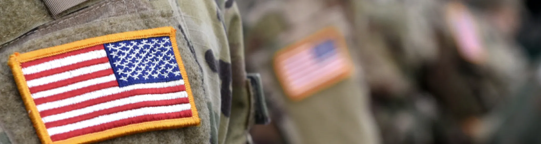 A picture of the United States flag on an American serviceperson's arm