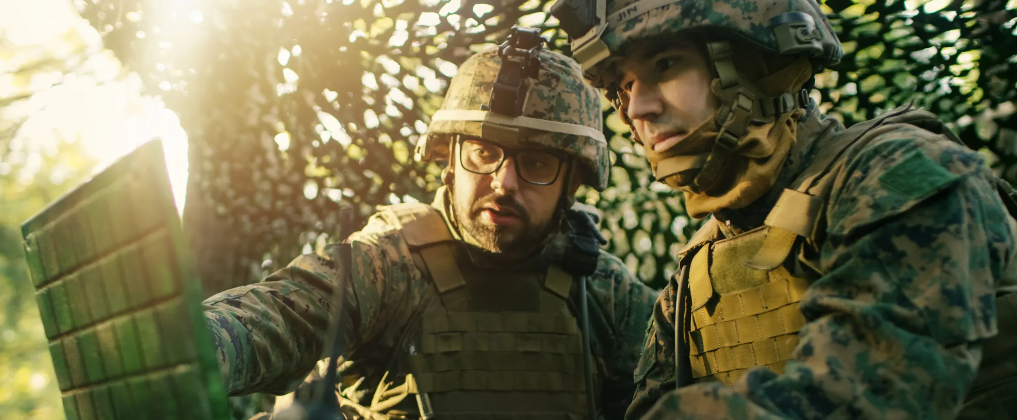 Military Staging Base, Officer Gives Orders to Chief Engineer, They Use Radio and Army Grade Laptop. They're in Camouflaged Tent in a Forest. They're on Reconnaissance Operation/ Mission.