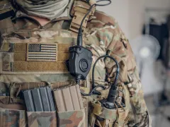 Closeup photo shoot of military man in USA army uniform with radio in his pocket.