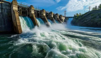 hydroelectric dam on a river with water flowing through the turbines.