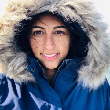 women's face peeking out from a winter coat