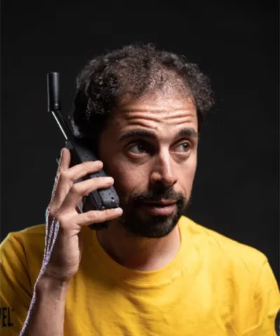 Omar di Felice using a satellite phone