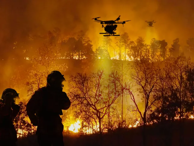Firefighting drones spray chemical to help control wildfires.