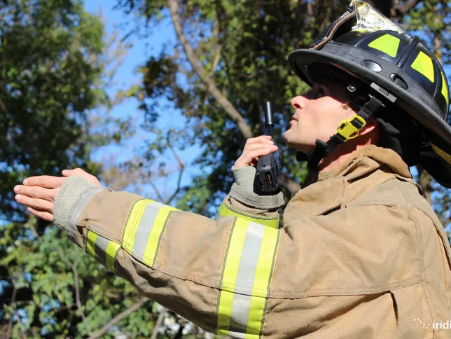 A firefigher using Iridium Extreme PTT