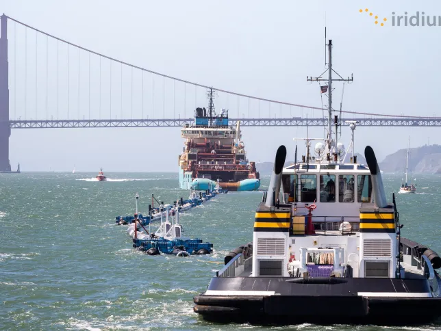 Iridium Pilot with bridge in background
