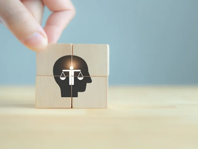 Wooden cubes being used to symbolize ethics in decision-making