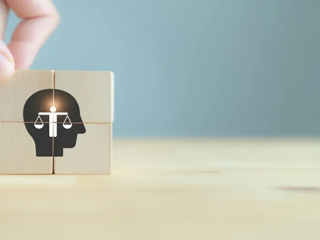 Wooden cubes being used to symbolize ethics in decision-making