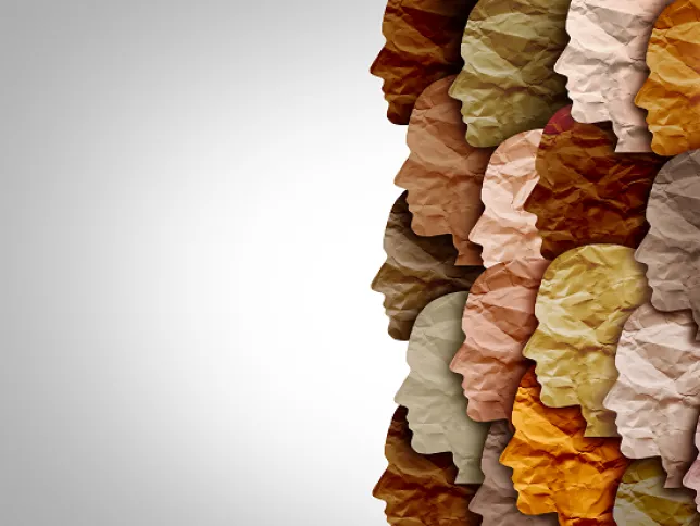 Silhouettes of human heads in profile, rendered in various skin tones and textures, representing diversity
