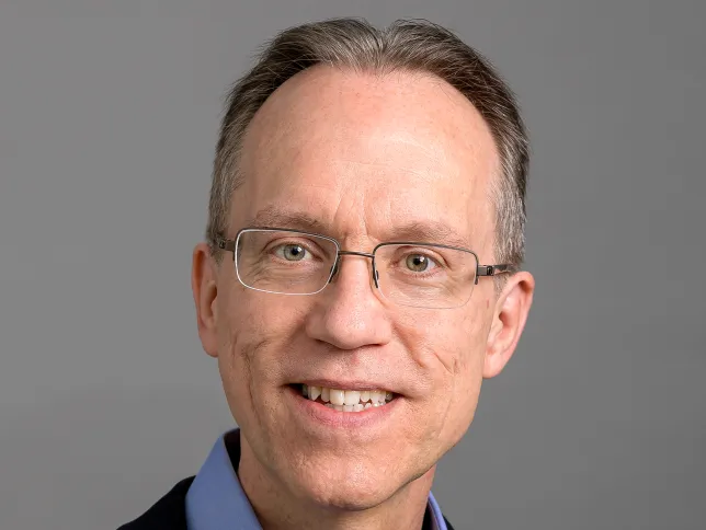 Headshot of Iridium Chief Technical Officer Greg Pelton