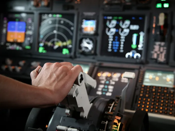 Flight simulator with pilot hand in throttle