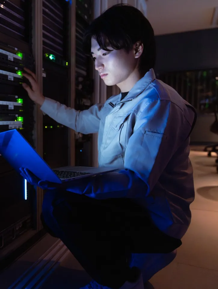 Technician working in server room