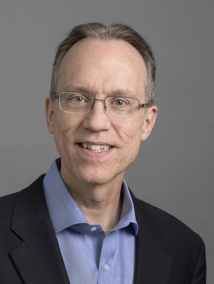 Headshot of Iridium Chief Technical Officer Greg Pelton