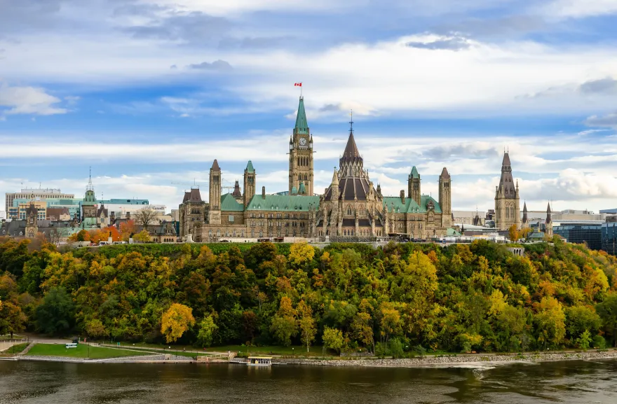 Stunning autumn view of Parliament Hill across the Ottawa River in Ottawa, Canada