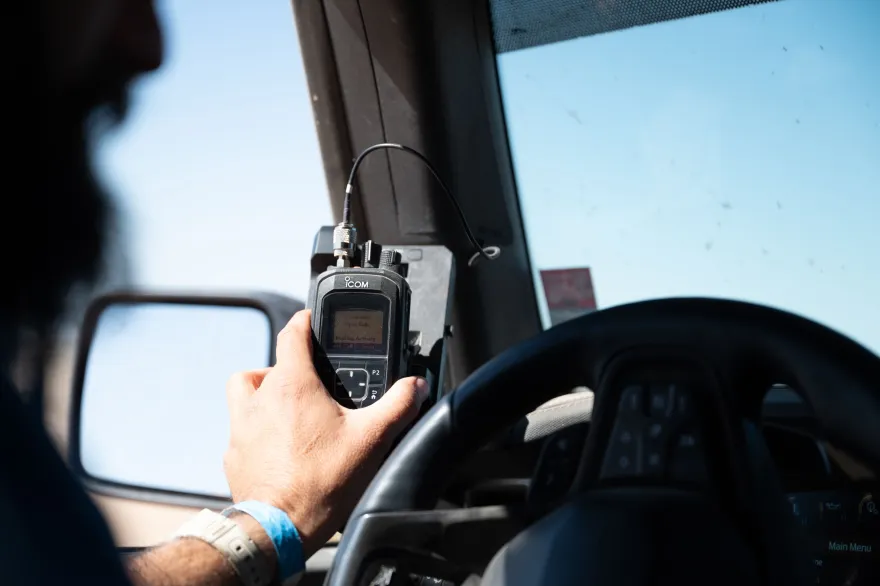 A hand holding a device