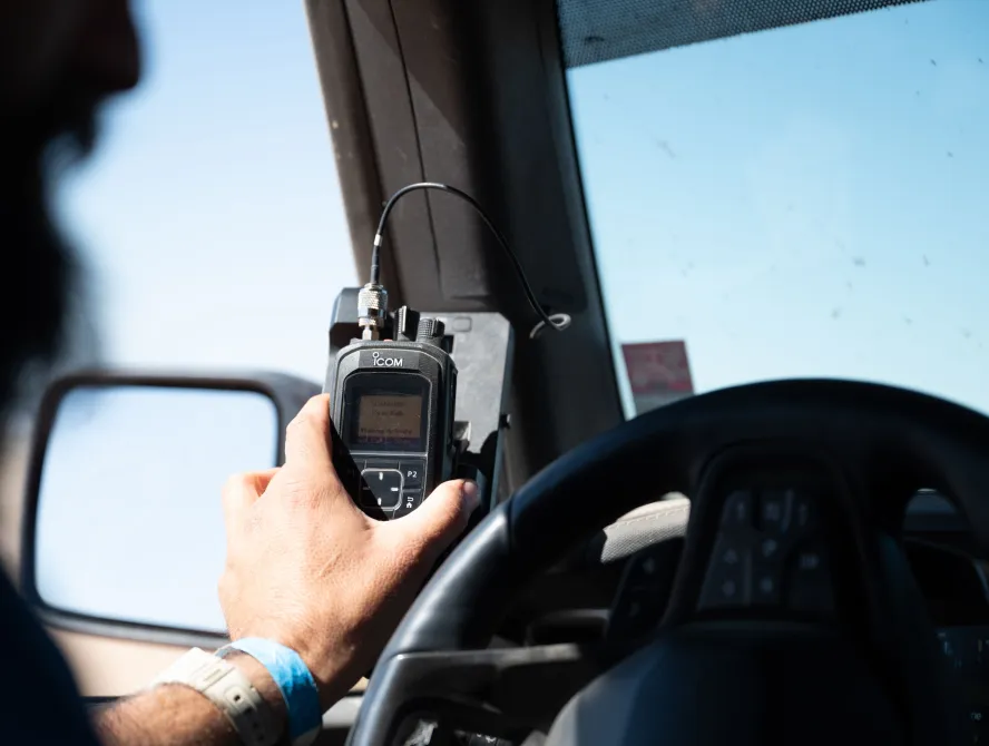 A hand holding a device