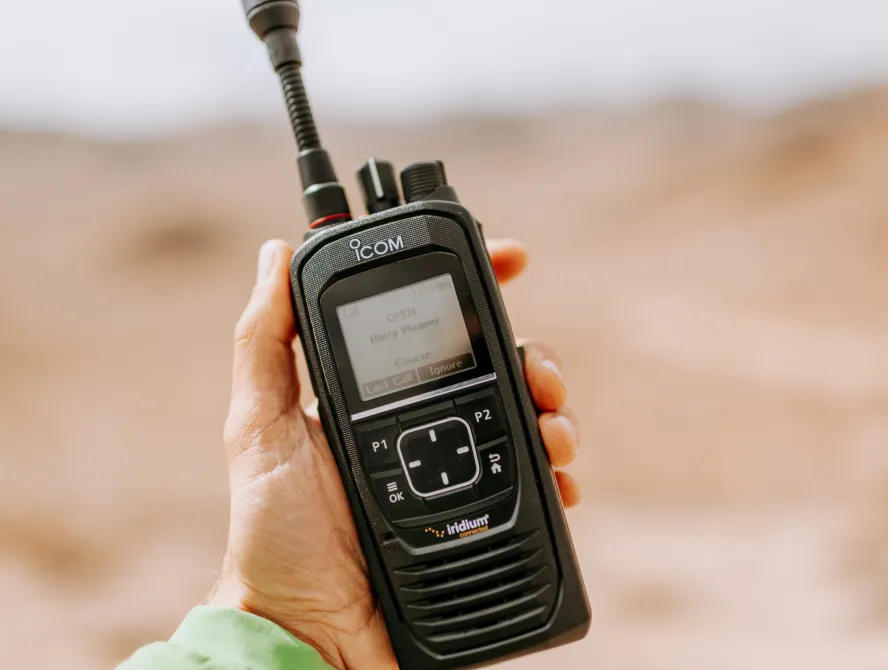 A hand holding a device