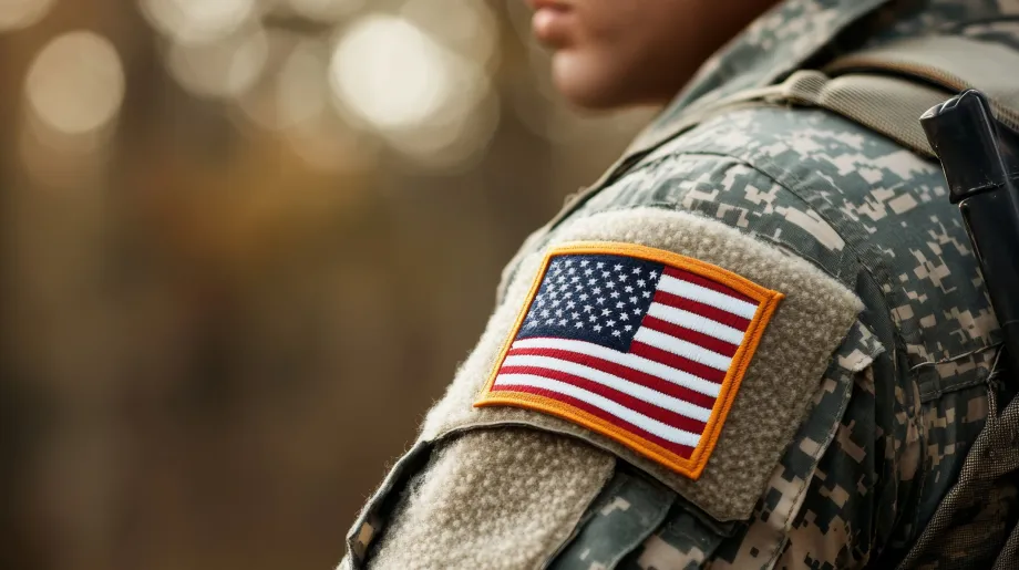 Marching soldiers with the American flag at dawn. A tribute to Veterans Day.