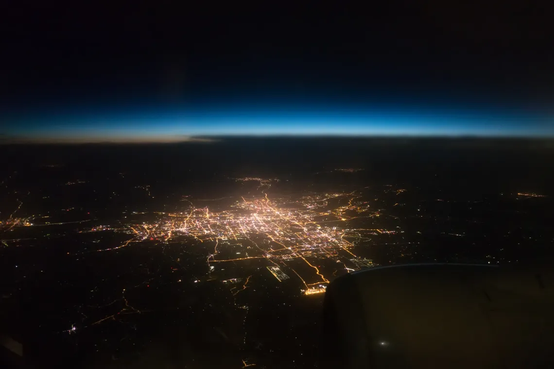 View city night from the window of an airplane