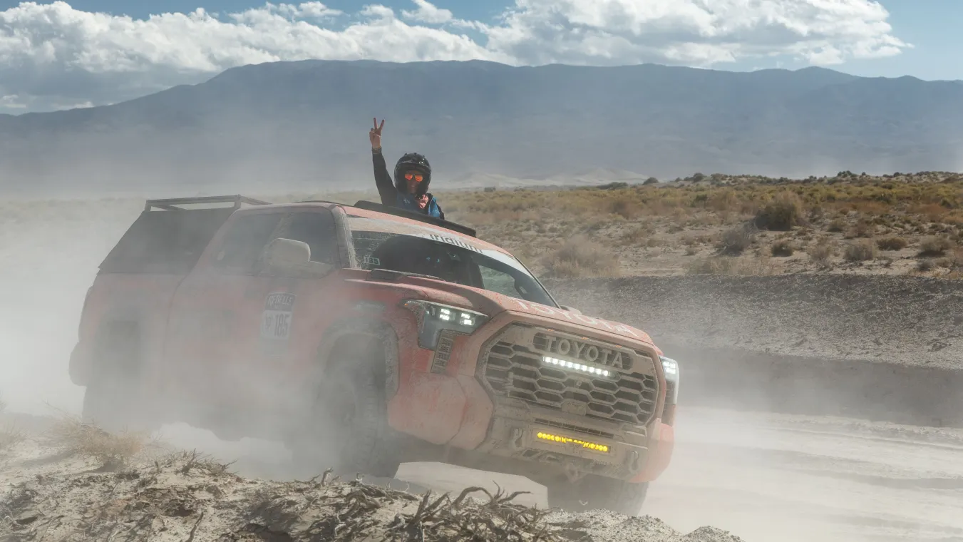 Rally racer in remote terrain staying connected via SATCOM.