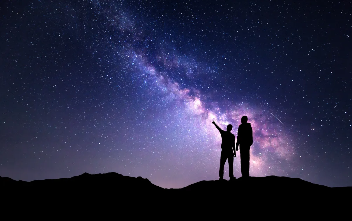 Two people stargazing