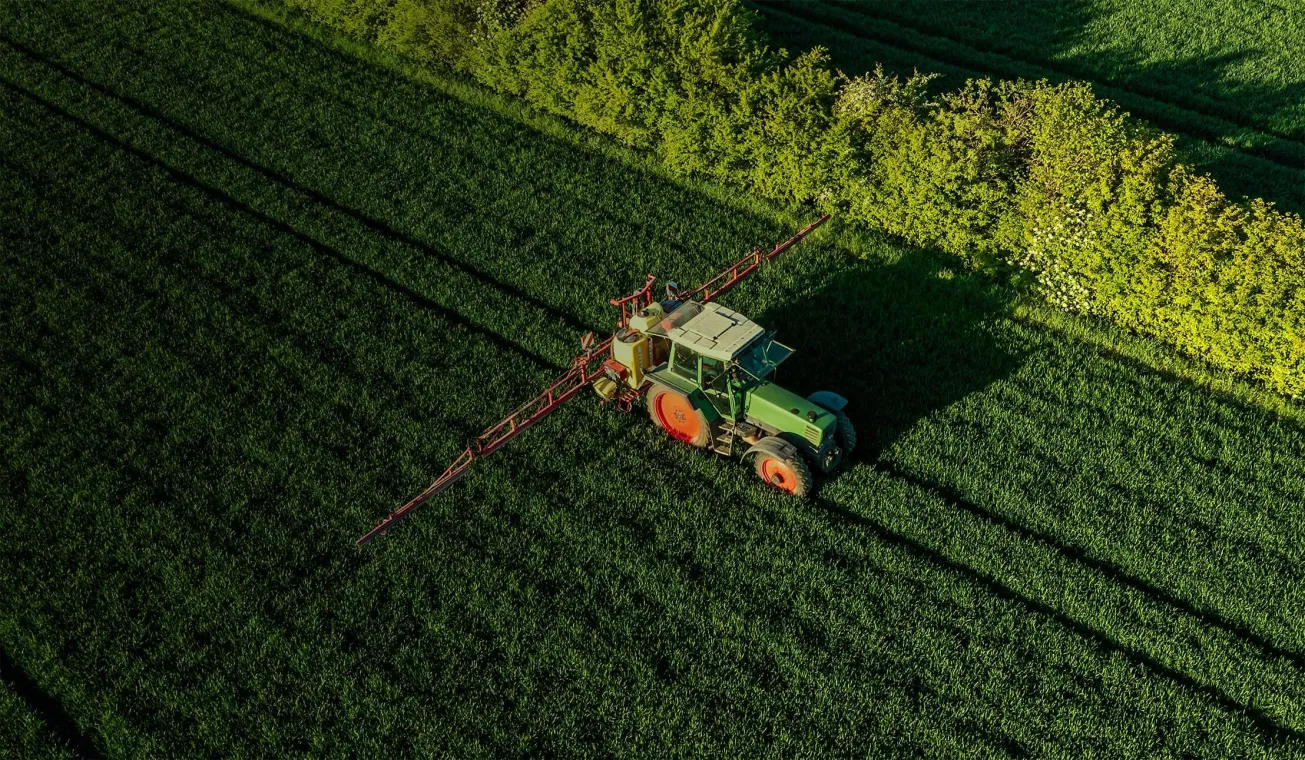Agricultural field with a tractor