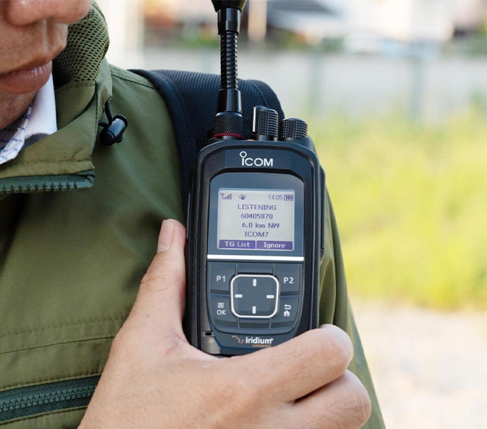 Icom IC-SAT100 ptt handset in use